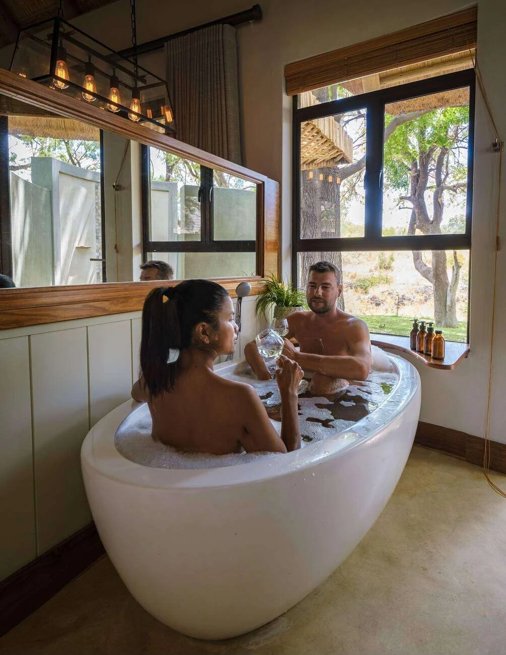 Couple relaxing in a luxury lodge bathtub